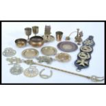 A collection of 20th Century brass items to include small Indian brass trays, horse brasses, a