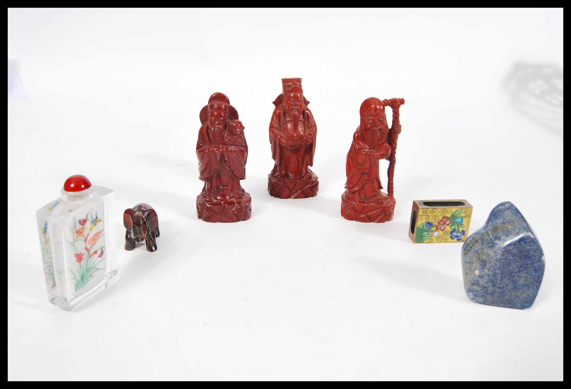 A collection of Oriental wares to include a set of three red Cinnabar lacquer type elder