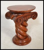 An antique style mahogany planter plant jardiniere torchere / bust stand raised on stepped