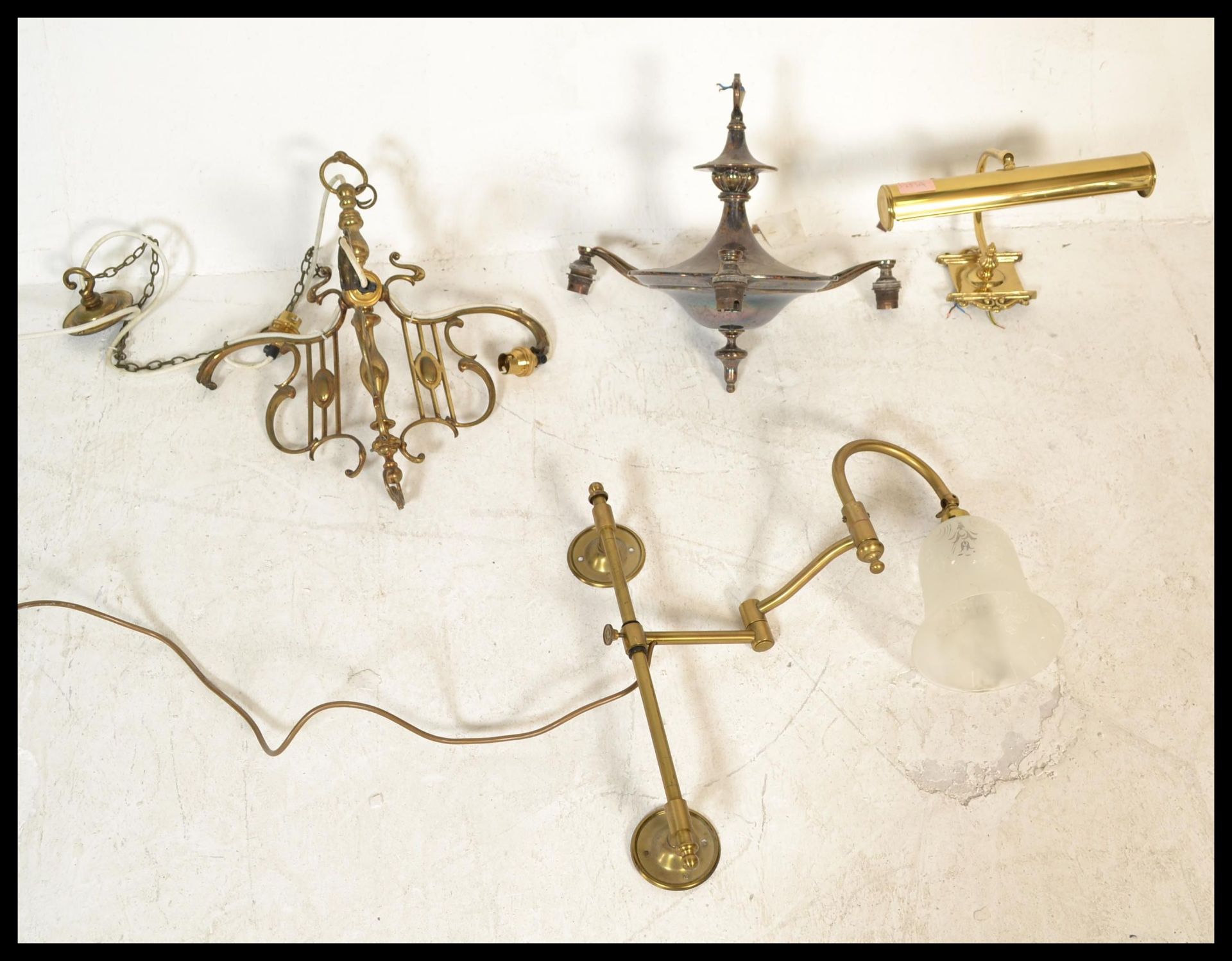 A group of vintage lighting to include a bankers lamp type wall light in brass, a silver plated