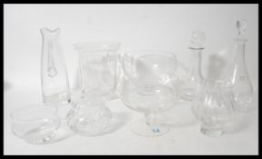 A collection of vintage glassware including Dartington glass and rayware to include two decanters,