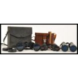 A group of vintage binoculars to include a pair of Russian Cold War CCCP binoculars 8x30, Regent