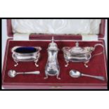 A vintage 20th Century Walker and Hall silver plated condiment cruet set complete in original box