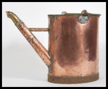 A 19th Century Victorian Aesthetic movement copper watering can having a bamboo effect spout.