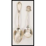 A 19th Century French silver table spoon having scrolled decoration to the handle along with a