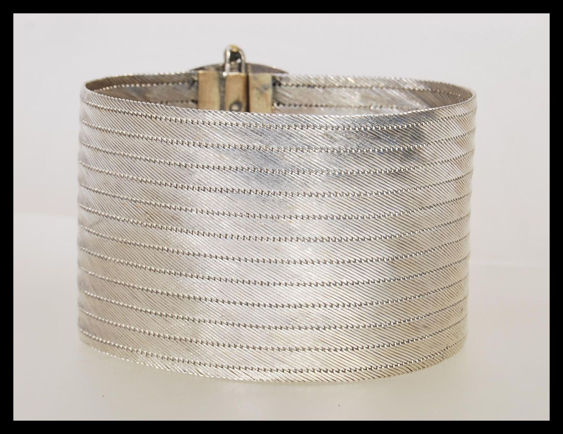 A stamped 900 silver ethnic style bangle bracelet having a rectangular clasp to the front with - Image 2 of 3