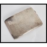 An early 20th Century hallmarked silver cigarette case by W T Toghill & Co. The case of shaped bowed