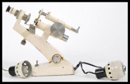 A vintage early 20th Century Microscope by Eyco made in Japan for East Yorkshire Optical Company.