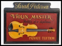A vintage style advertising wall plaque advertising a Violin Master Private Tuition wooden sign