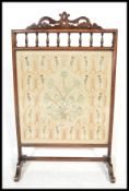 A 19th Century framed fire screen guard having a fantastic hand embroidered silk panel depicting a