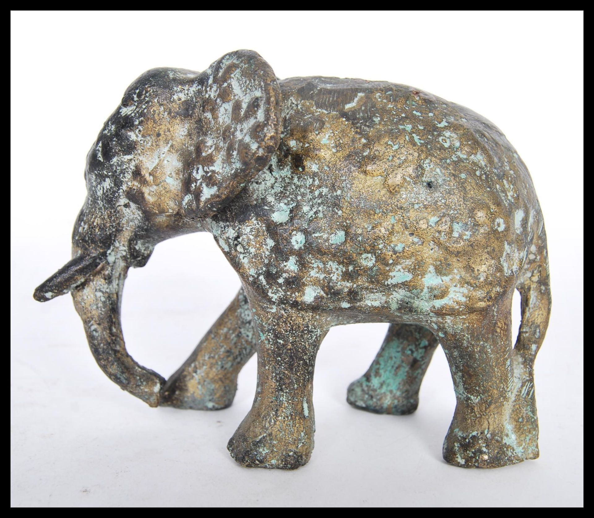 A 19th Century bronze figurine in the form of a Bull Elephant with tusks in full run, having - Bild 2 aus 3