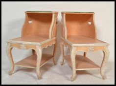 A pair of 20th century shabby chic revival bedside cabinet raised on sabre style supports with