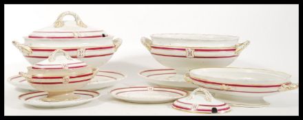 A rare 19th Century Victorian hand painted ironstone dinner service having gilt and red belt