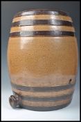 A large 19th Century Doulton Lambeth stoneware salt glazed barrel of tall form having impressed