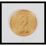 A 22ct gold 1981 sovereign having the Queen Elizabeth II facing right with George and the dragon