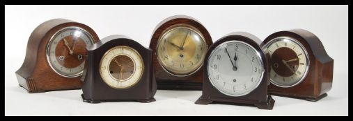 A group of five vintage early 20th Century mantel clocks to include three oak cased examples and two