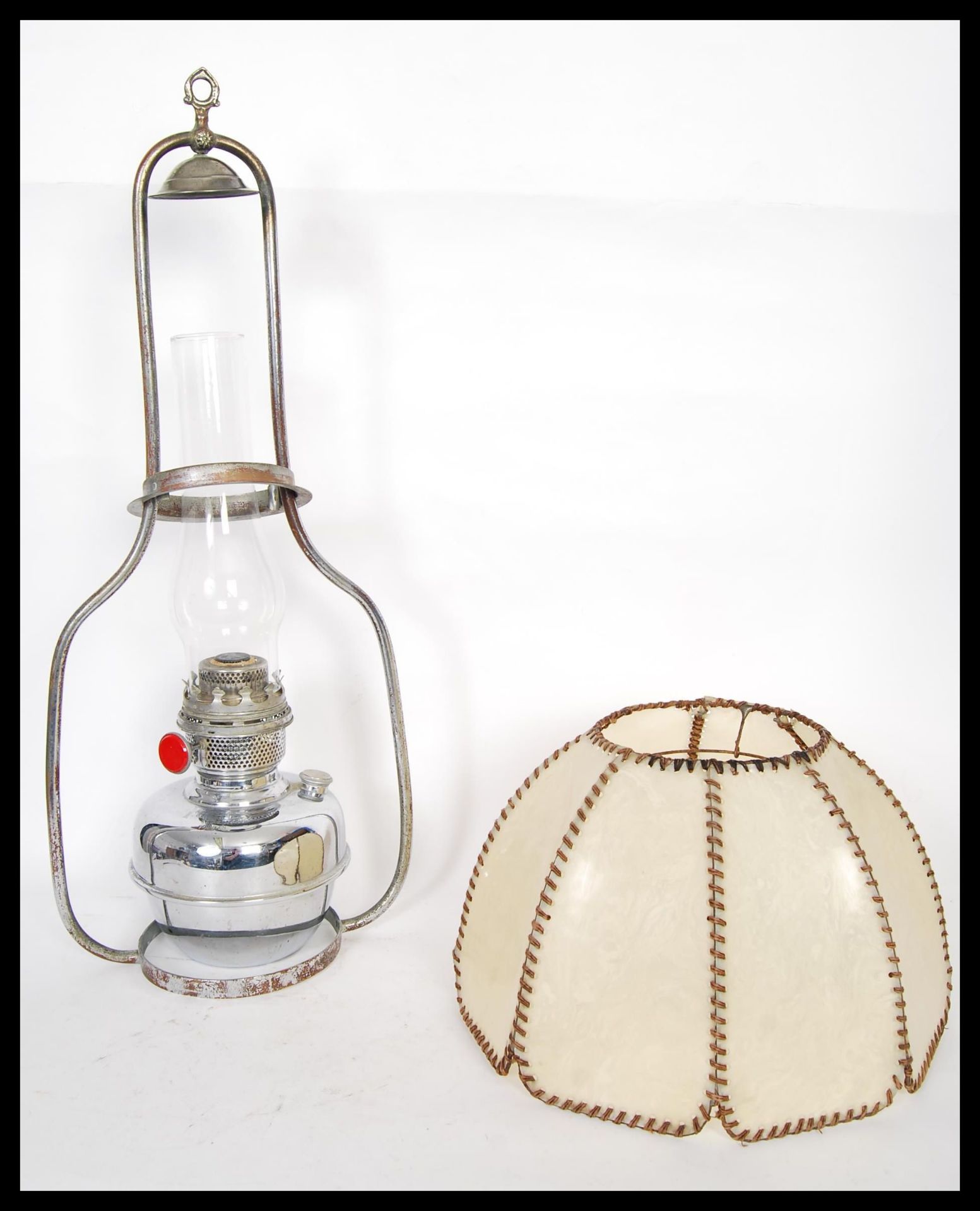 An Art Deco 1930's German Famos 120cp suspending oil lamp having a faux hide shade, glass flu and