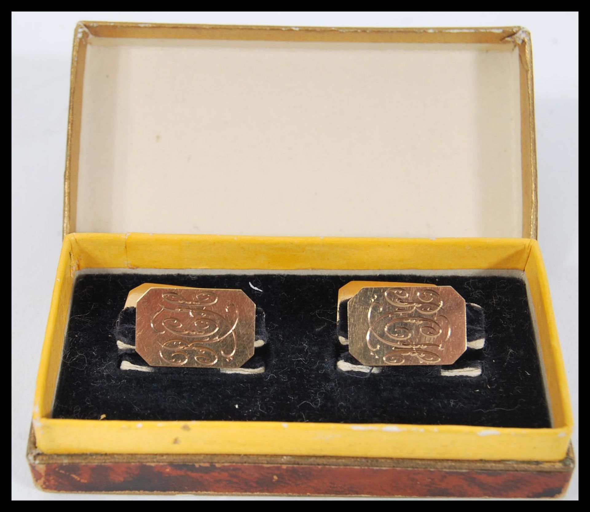 A pair of early 20th Century hallmarked 9ct gold Art Deco gents cufflinks of octagonal form having