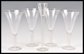 A set of five 19th Century Victorian drinking glasses comprising of a set of four wine glasses