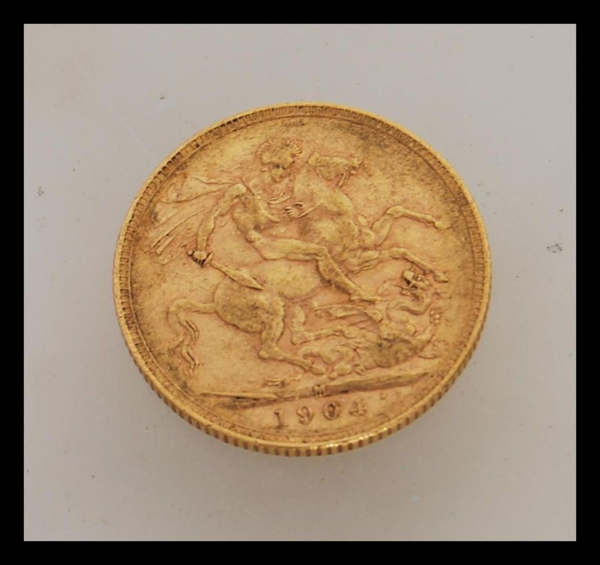 A 1904 Edward VII full gold sovereign stamped for the Melbourne mint. Weight 8.0g. - Image 2 of 2