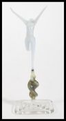 An early 20th Century Venetian glass opaline glass figurine of a maiden raised on square base. The
