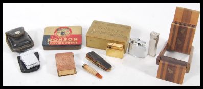 A collection of vintage 20th Century smoking related items to include a Ronson Service Outfit tin, a