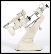 A vintage early 20th Century Microscope by Tokyo Kogaku Kikai K.K. No 3647. Original enamel finish.
