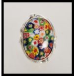 A stamped 925 silver dress ring set with a large resin millfiori panel, having pierced decoration