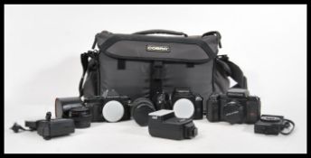 A good collection of pentax cameras and accessories to include three Pentax cameras, lenses, flashes