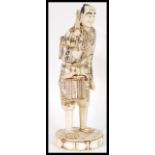 A 19th Century Japanese Meiji period large and impressive bone figurine depicting a merchantman