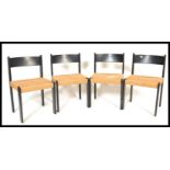 A set of four vintage retro 20th Century Danish dining chairs raised on ebonised beech frames with