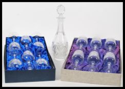 A boxed set of six Edinburgh cut crystal continental collection wine glasses along with a set of six