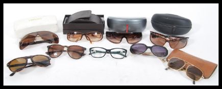 A collection of believed original designer sunglasses and glasses to include Prada, Tiffany and