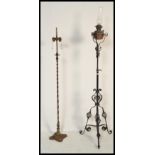 Two antique 19th / early 20th Century standard lamps to include a scrolled example and another