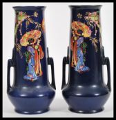 A pair of 1930's Art Deco twin handled vases by Rubian pottery, each with Geisha scenes being