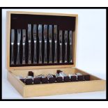 A vintage 20th Century canteen of cutlery by Arthur Price complete in fitted light oak flatware box.