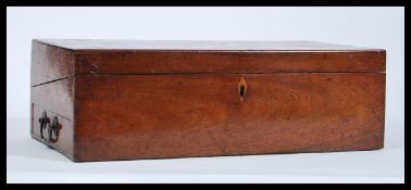 A large 19th Century mahogany Victorian writing slope box having hinged lid opening to reveal fitted