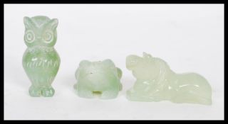 Three 20th Century carved jadeite figures to include an owl, horse and frog. Tallest measures approx