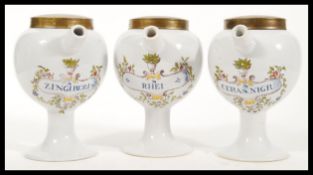 A set of three 18th Century Dutch style apothecary tin glazed earthenware pots of globular form