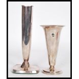 Two vintage 20th Century continental silver 830s solifleur candlesticks one raised on square base