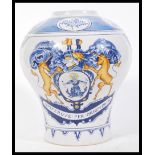 A large 18th Century Dutch style apothecary tin glazed earthenware jar having polychrome