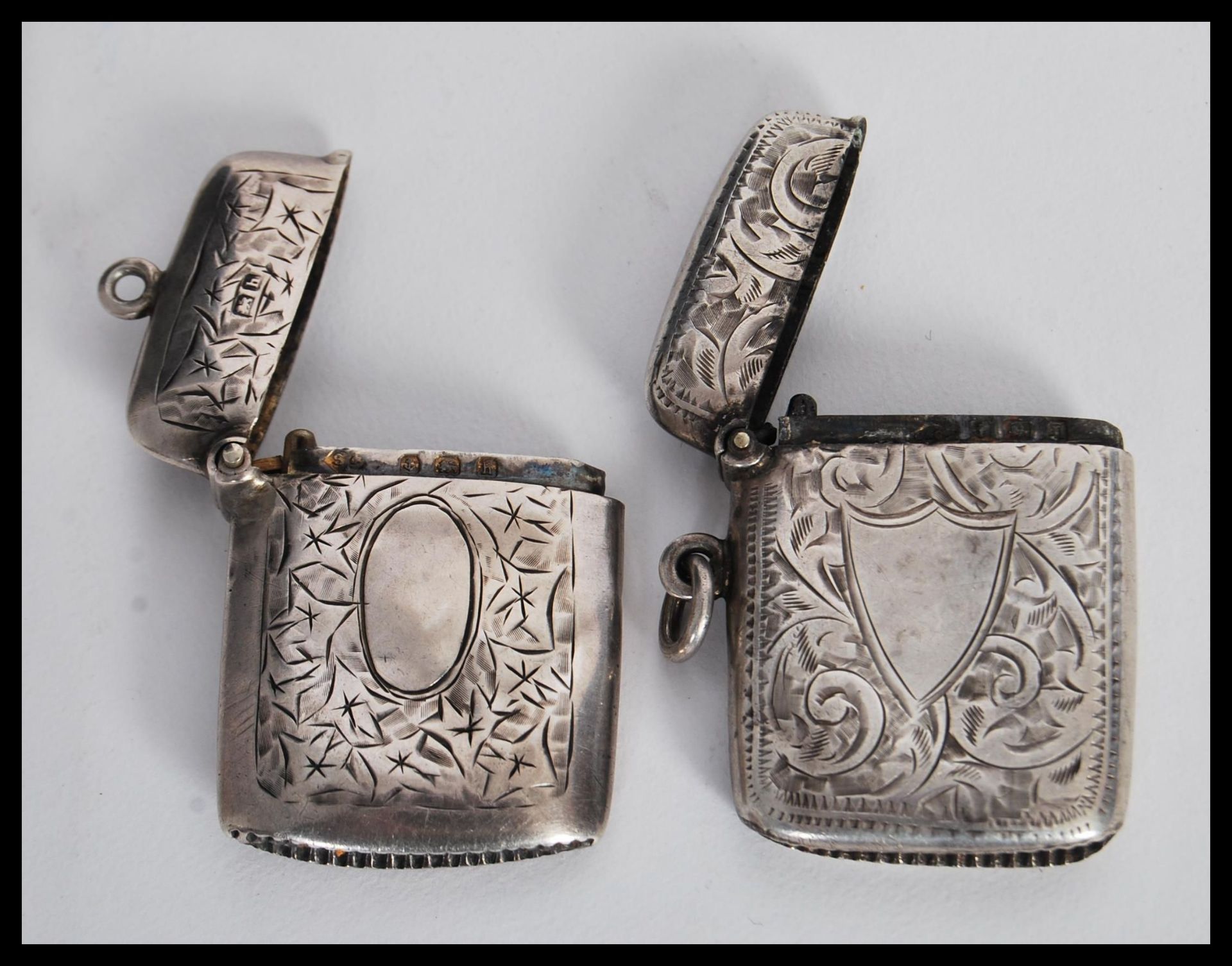 Two early 20th Century hallmarked silver vesta match cases having engraved scrolled decoration - Image 4 of 4