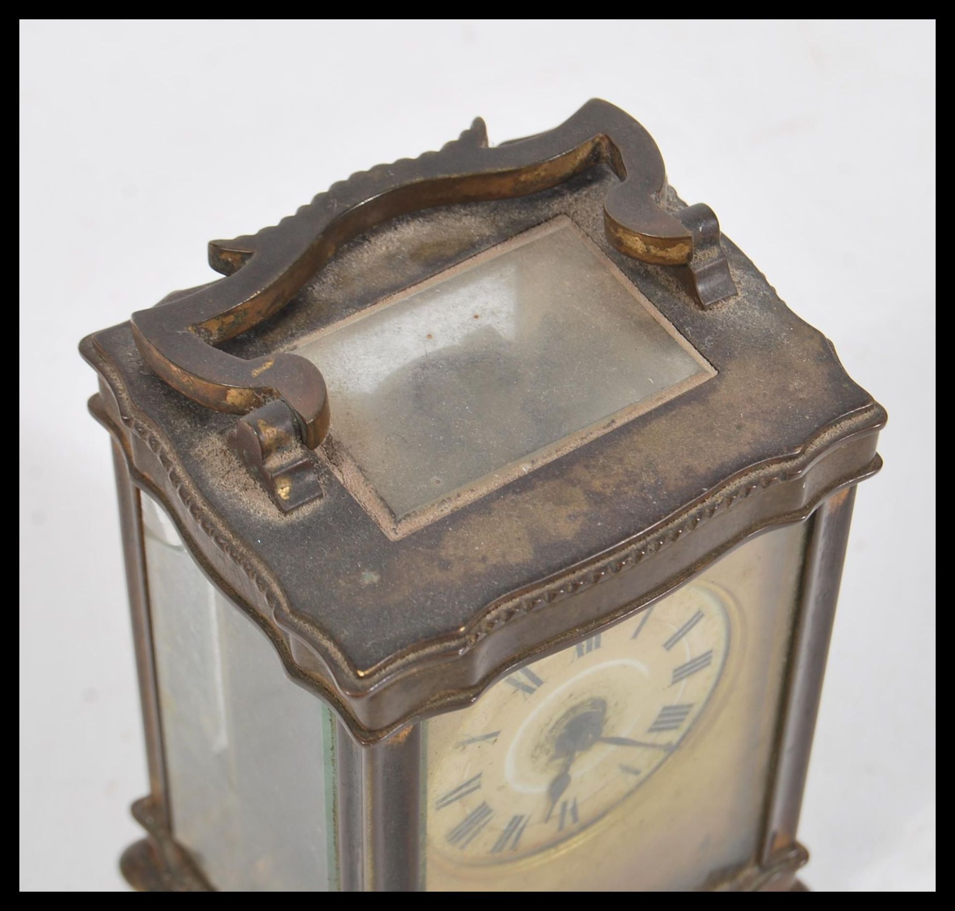 A 19th Century French brass carriage clock having a Roman numeral chapter ring with swing handle - Image 2 of 5