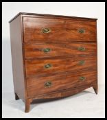 A George III mahogany secretaire / bachelors chest of drawers. Raised on French kick feet with a
