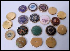 A collection of 19 vintage 20th Century compacts all by Stratton to include enamel decorated, floral
