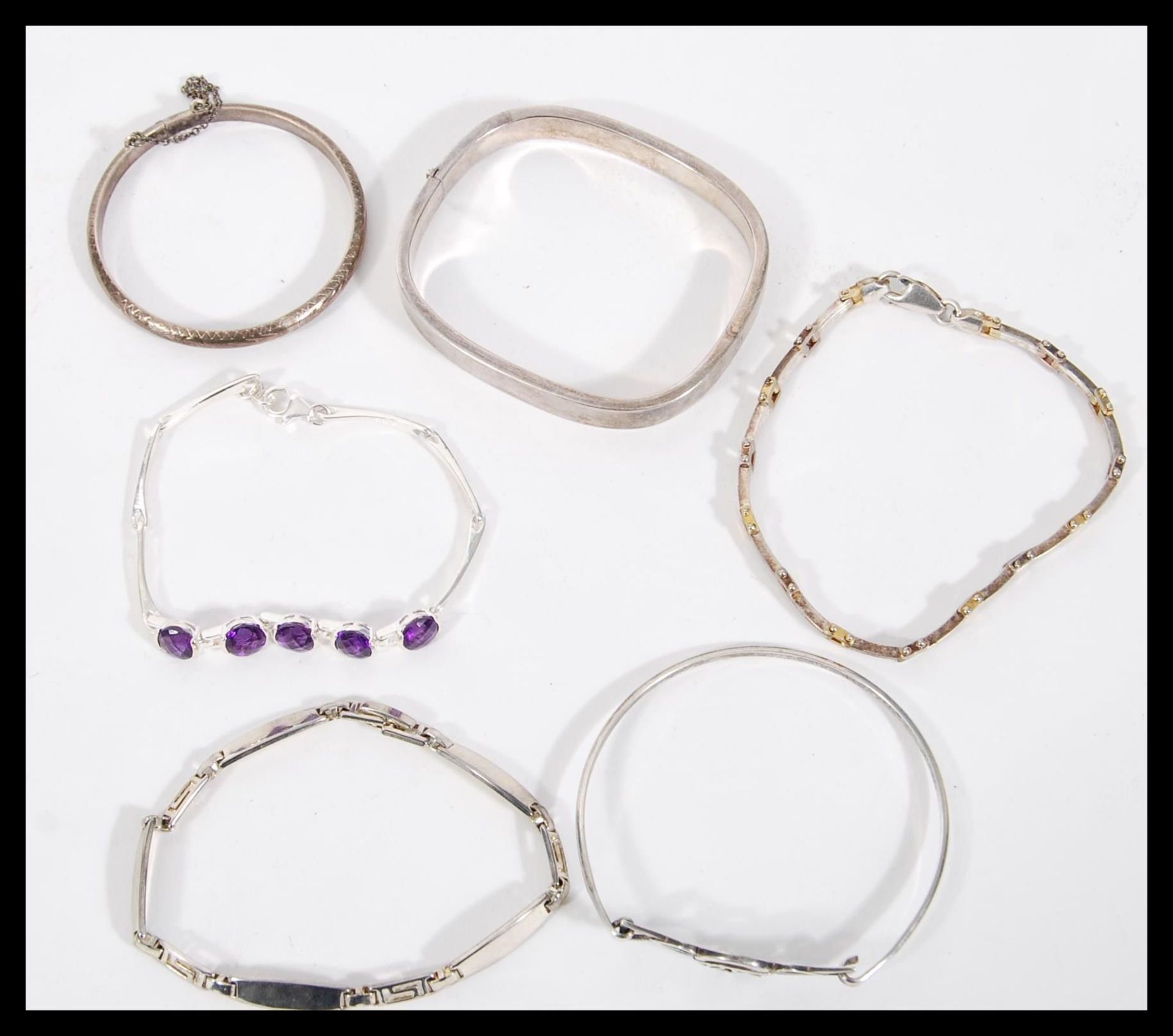 A selection of silver bracelets to include a square bangle with a hinge opening, a child's bangle - Image 5 of 5