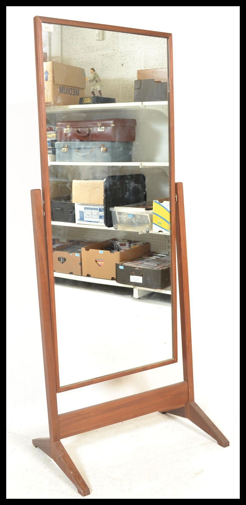 A vintage retro Teak wood cheval free standing full length mirror raised on a square supports