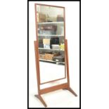 A vintage retro Teak wood cheval free standing full length mirror raised on a square supports