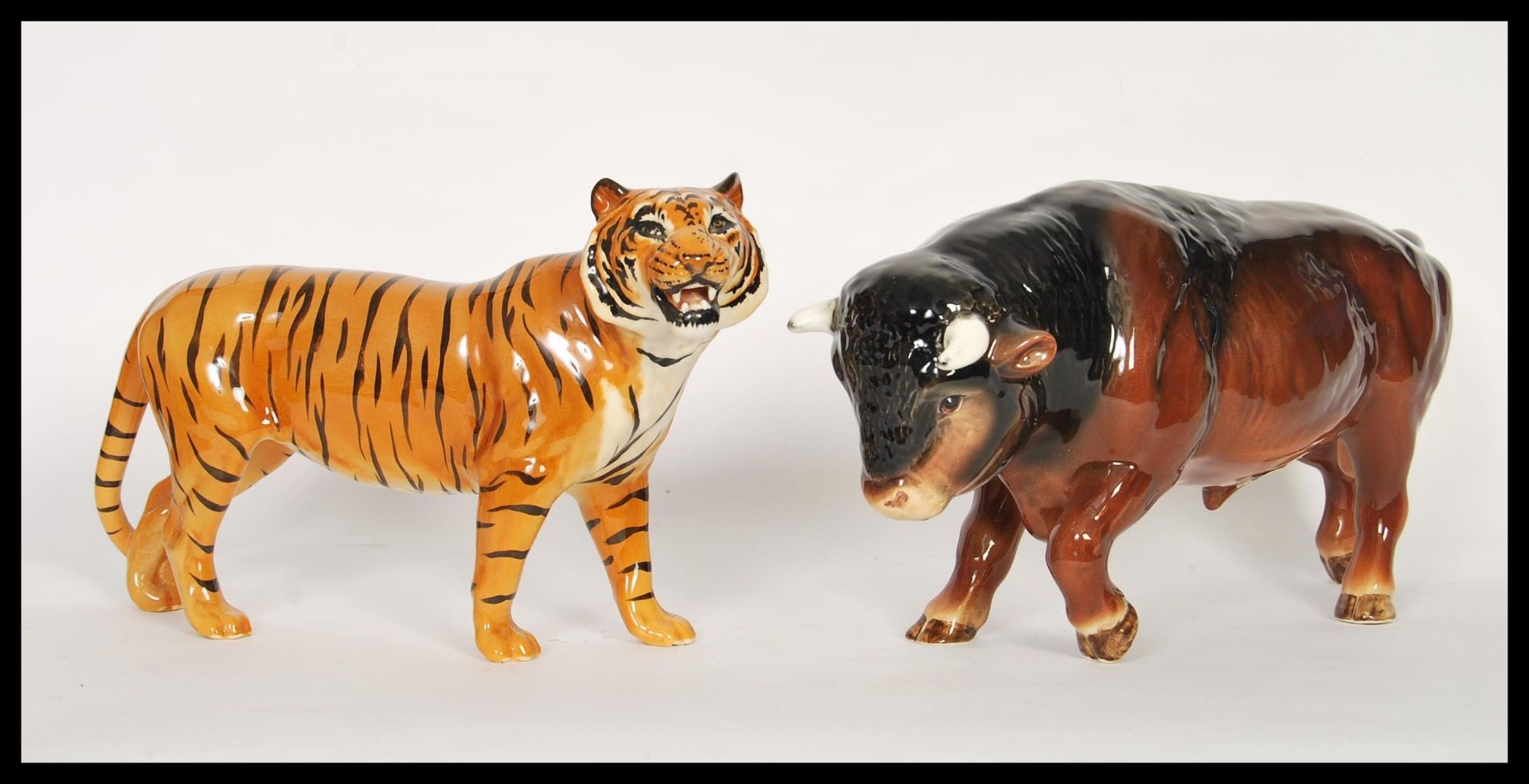 A large vintage 20th Century Beswick ceramic figurine in the form of a tiger along with a SylvaC