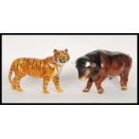 A large vintage 20th Century Beswick ceramic figurine in the form of a tiger along with a SylvaC